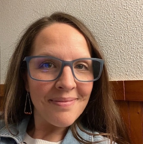 Close up headshot of Michelle de Oliviera, OT Lead, in glasses.