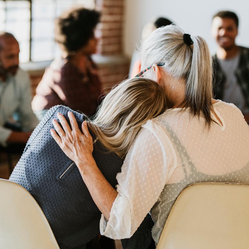 People support each other in a rehab session