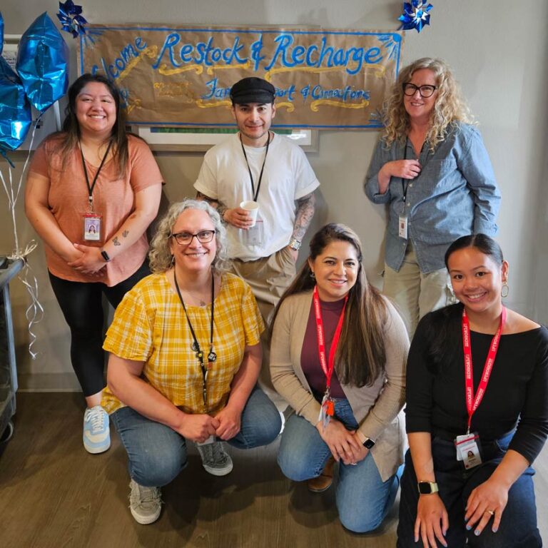 The Family Support and Connections team gathers for a group photo during a Child Abuse Prevention Month event.