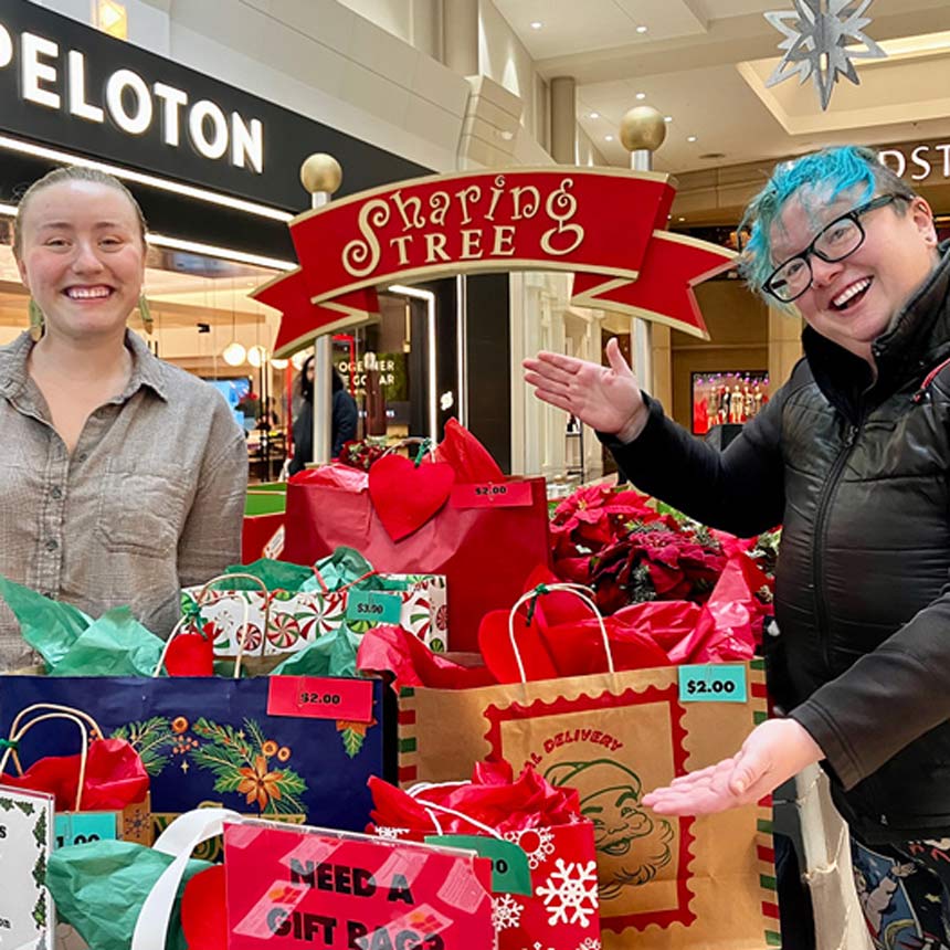 Lifeworks NW staff at the Sharing Tree in Washington Square Mall.